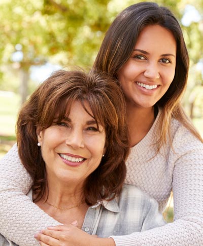 mother and daughter smiling