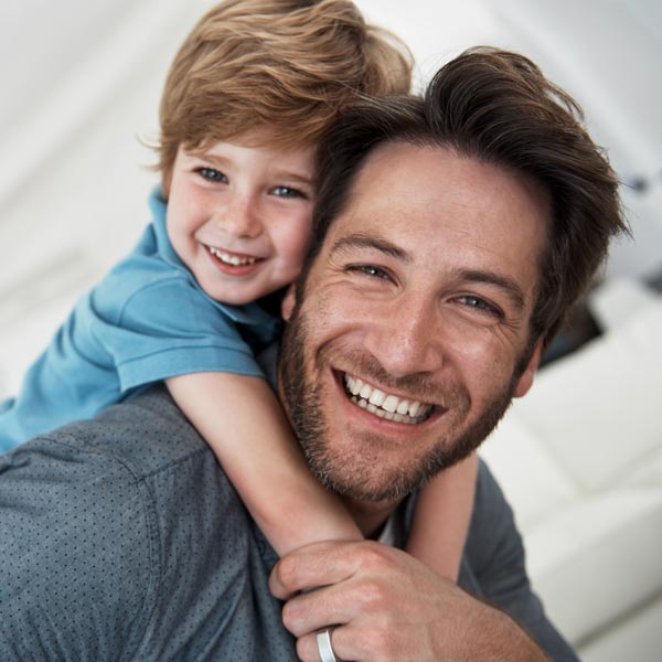 smiling father and son