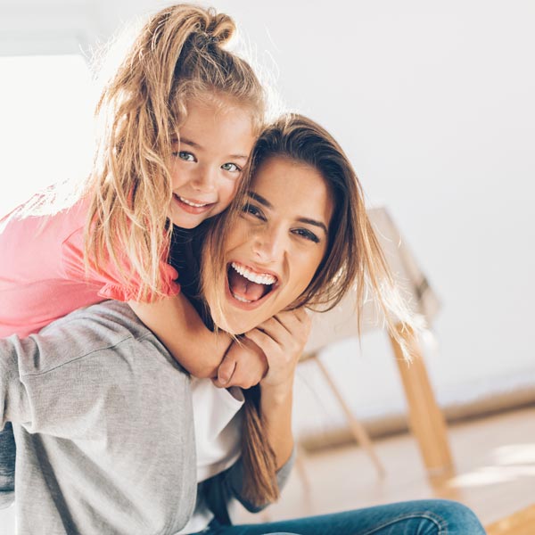 mother and daughter laughing