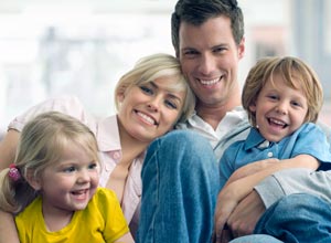 smiling family of four
